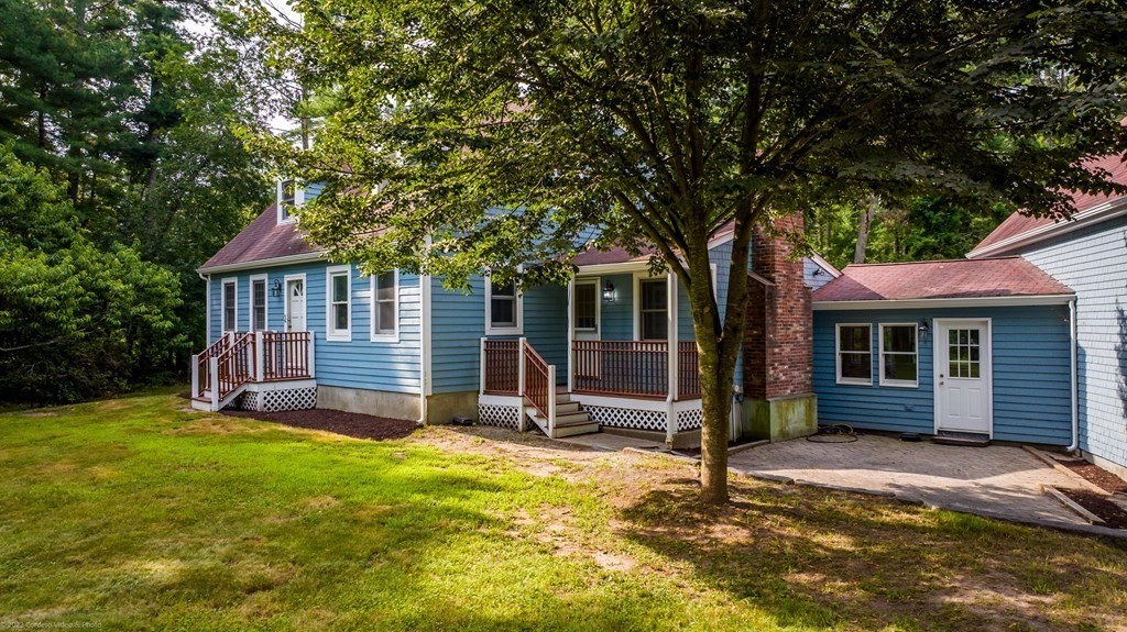 1 Canterberry Path Carver, MA 02330 - Photo 3 of 40 a house with garden in front of it