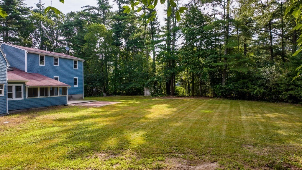 1 Canterberry Path Carver, MA 02330 - Photo 38 of 40 a view of swimming pool with lawn chairs and large trees