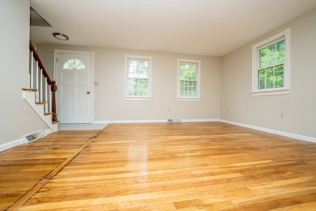 1 Canterberry Path Carver, MA 02330 - Photo 5 of 40 a view of an empty room with window and wooden floor