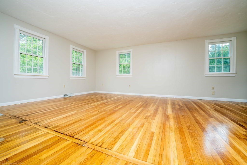 1 Canterberry Path Carver, MA 02330 - Photo 8 of 40 a view of empty room with wooden floor and fan