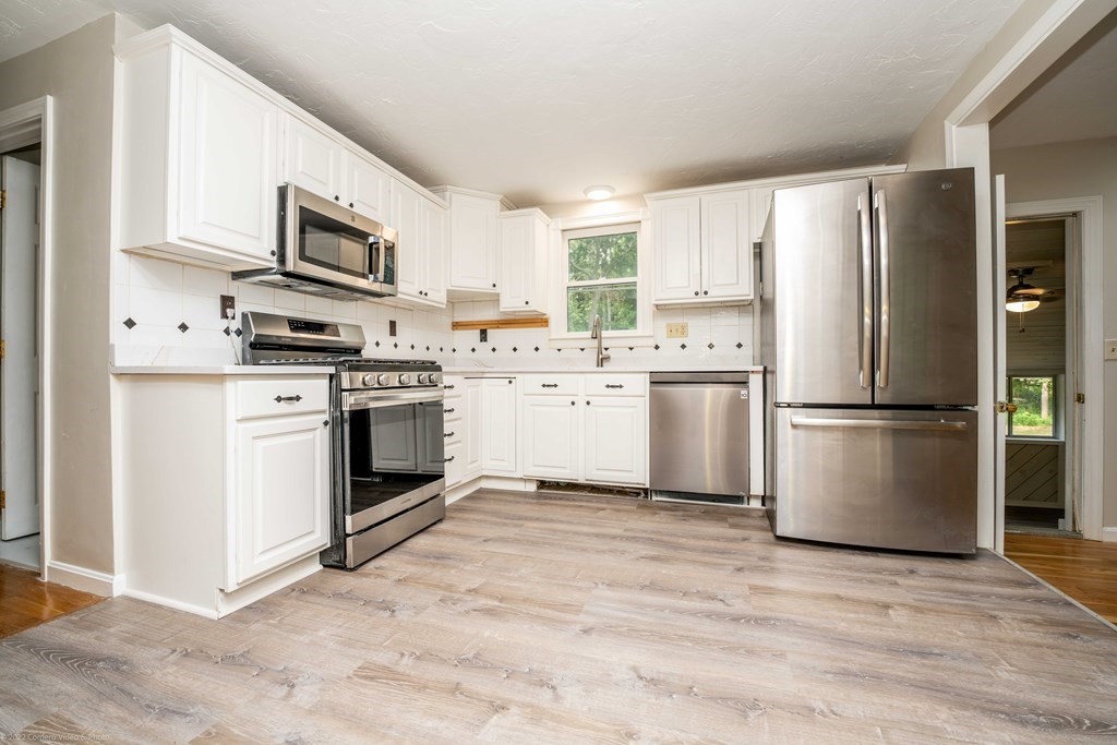 1 Canterberry Path Carver, MA 02330 - Photo 10 of 40 a kitchen with stainless steel appliances a refrigerator sink and microwave