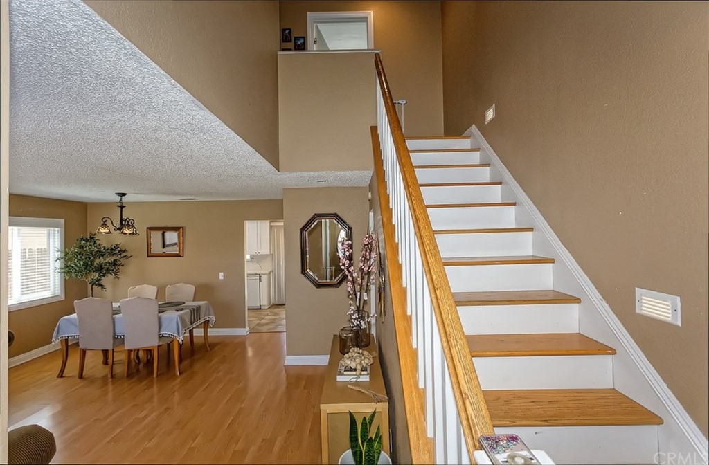 10829 Pepper Street Adelanto, CA 92301 - Photo 11 of 48 a view of a dining room with furniture and wooden floor