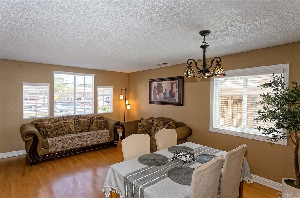 10829 Pepper Street Adelanto, CA 92301 - Photo 14 of 48 a living room with furniture and a window