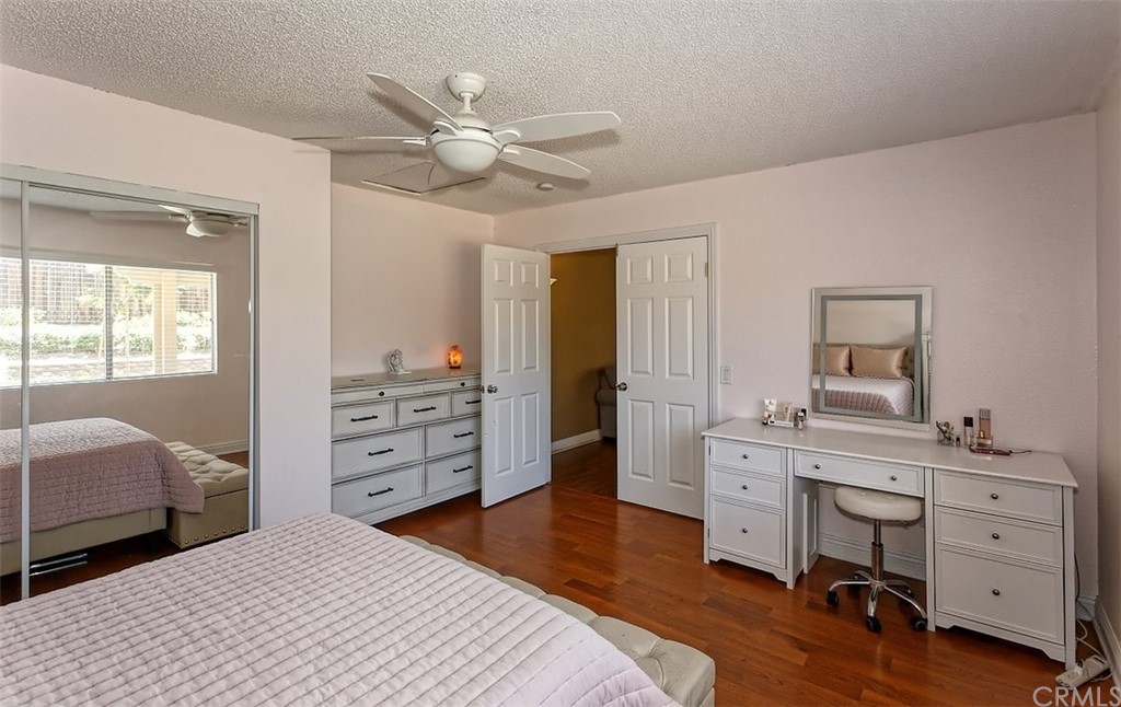 10829 Pepper Street Adelanto, CA 92301 - Photo 22 of 48 a bedroom with a bed and a dresser
