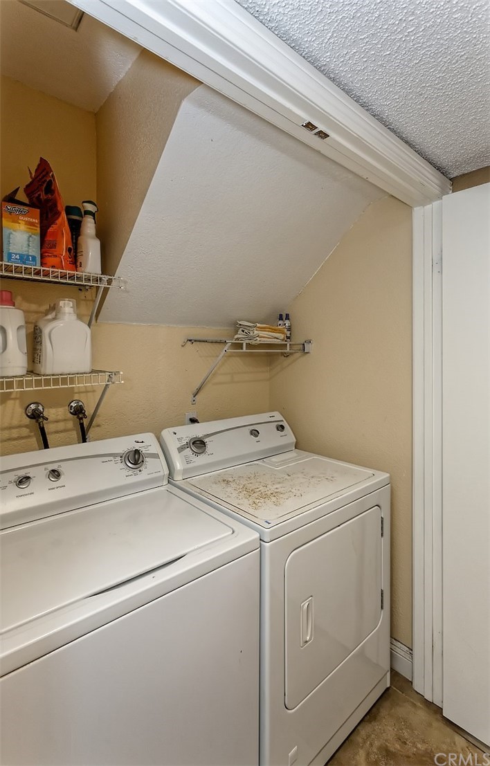 10829 Pepper Street Adelanto, CA 92301 - Photo 24 of 48 a utility room with dryer and washer