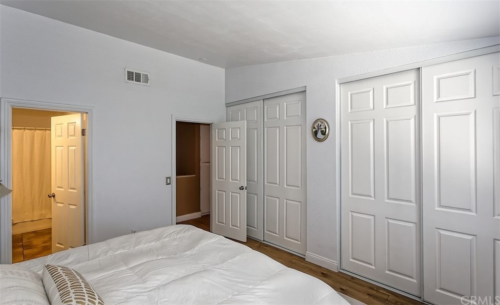 10829 Pepper Street Adelanto, CA 92301 - Photo 29 of 48 a bedroom with a bed and a window