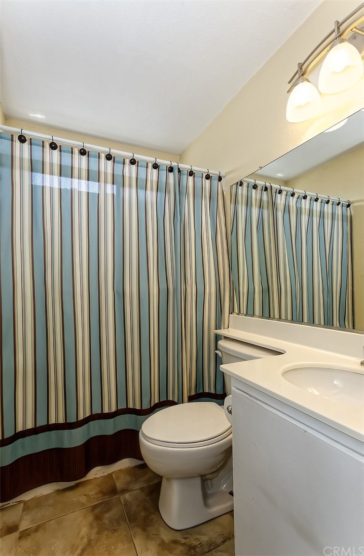 10829 Pepper Street Adelanto, CA 92301 - Photo 37 of 48 a bathroom with a toilet and a sink