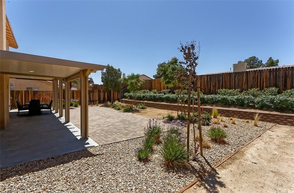 10829 Pepper Street Adelanto, CA 92301 - Photo 38 of 48 a view of a swimming pool with a patio