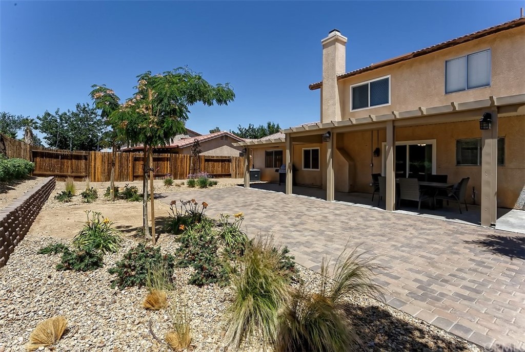 10829 Pepper Street Adelanto, CA 92301 - Photo 40 of 48 a front view of a house with a yard