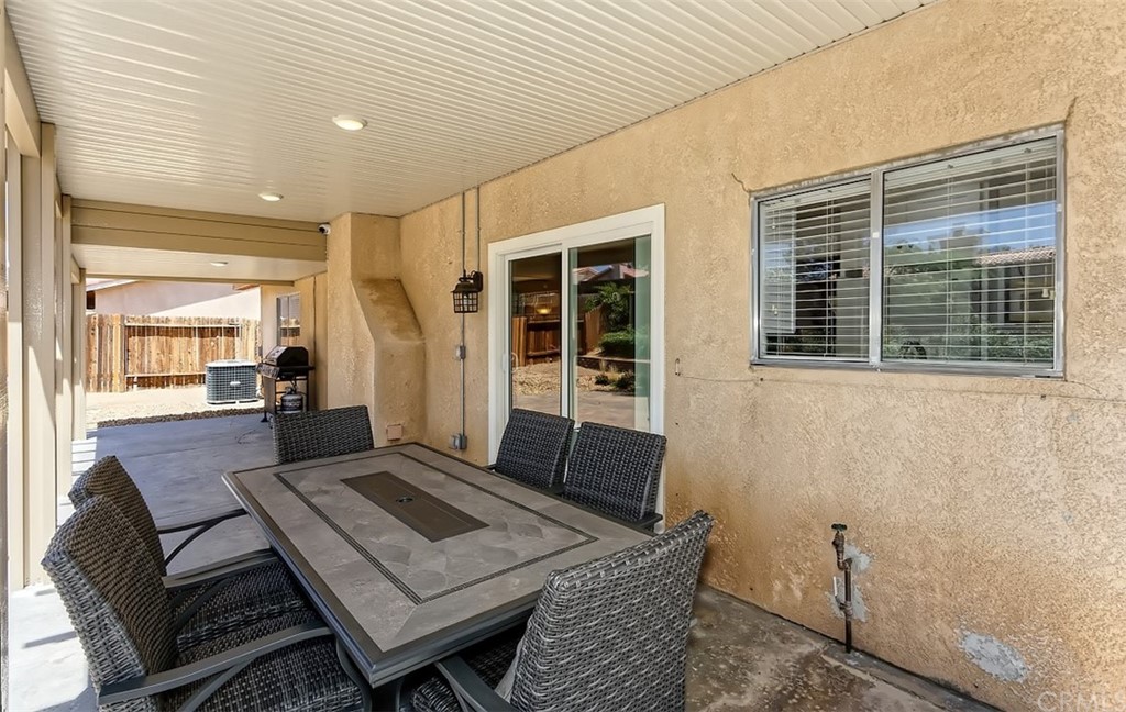 10829 Pepper Street Adelanto, CA 92301 - Photo 43 of 48 a living room with a couch and a table