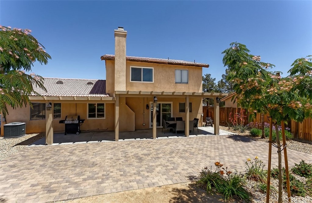 10829 Pepper Street Adelanto, CA 92301 - Photo 44 of 48 a view of a house with a yard