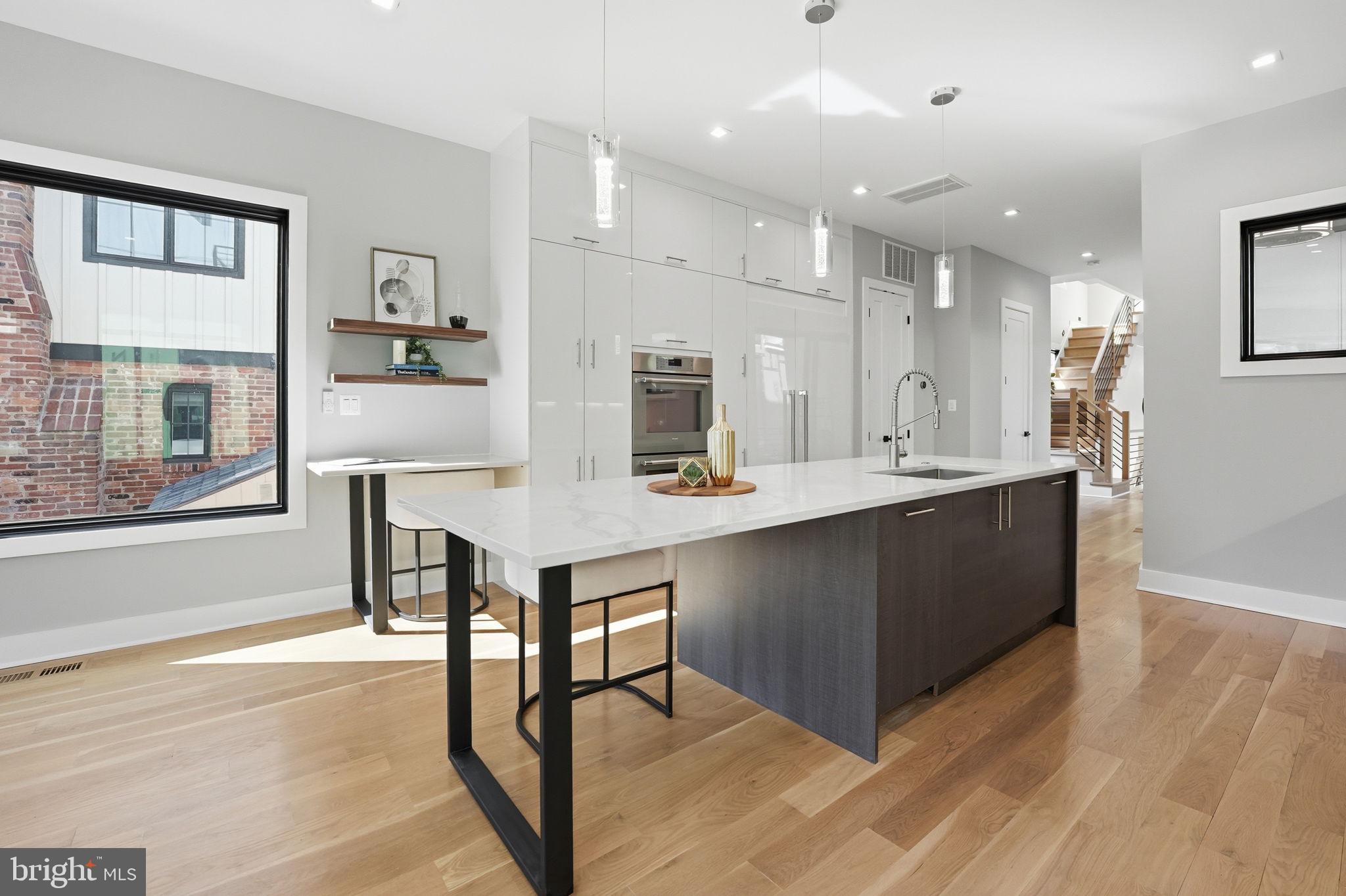 2211 Military Road Arlington, VA 22207 - Photo 21 of 107 Sleek modern kitchen with natural light.