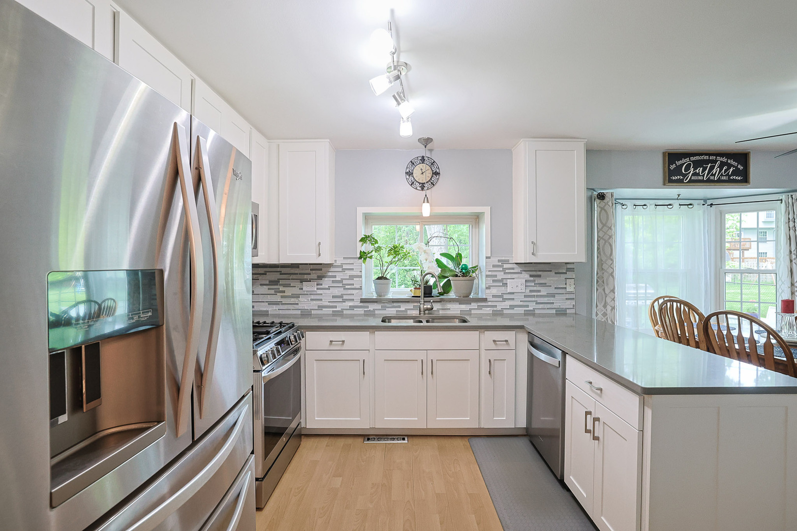 830 Hawk Lane Carol Stream, IL 60188 - Photo 7 of 30 a kitchen with stainless steel appliances granite countertop a sink stove and refrigerator