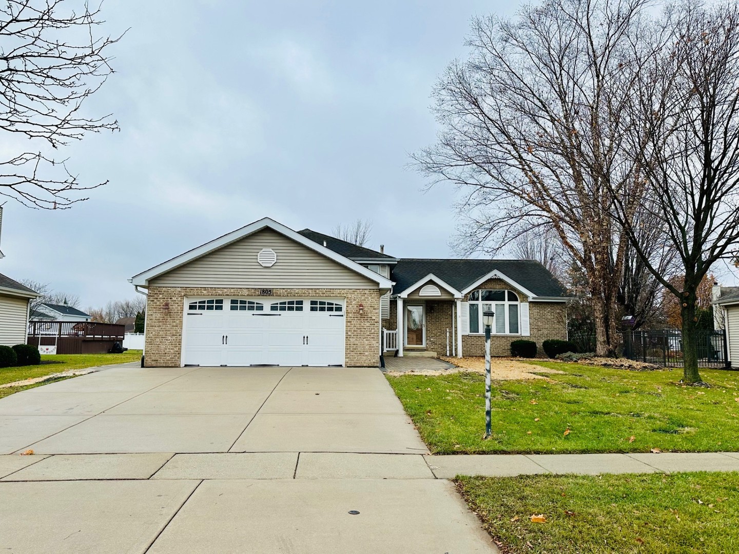 1805 Pebble Beach Drive Plainfield, IL 60586 - Photo 1 of 18 a front view of a house with garden