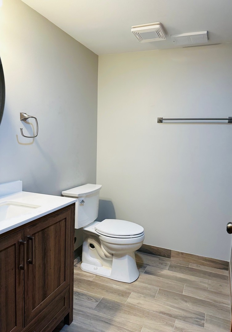 1805 Pebble Beach Drive Plainfield, IL 60586 - Photo 7 of 18 a bathroom with a sink a toilet and a mirror