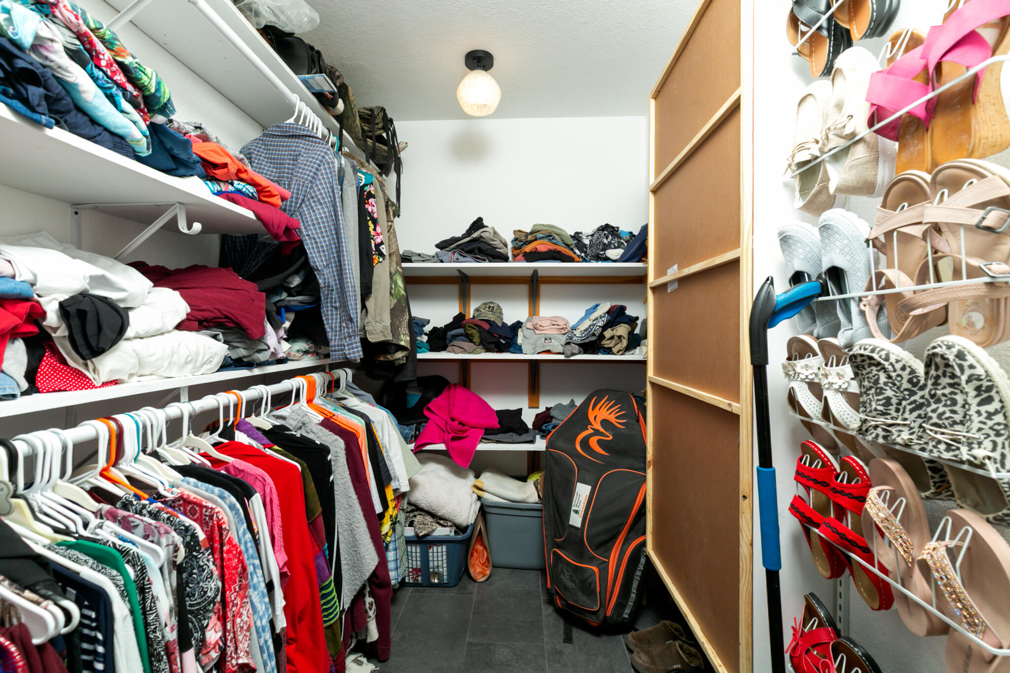 1141 Orange Loop Okeechobee, FL 34974 - Photo 12 of 20 a view of walk in closet with clothes and shoes