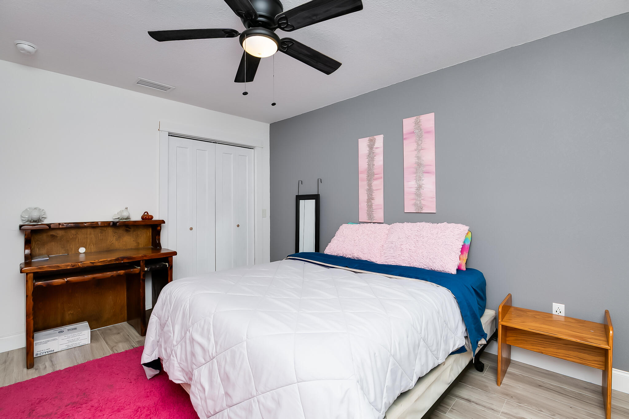 1141 Orange Loop Okeechobee, FL 34974 - Photo 14 of 20 a bedroom with a bed and a piano