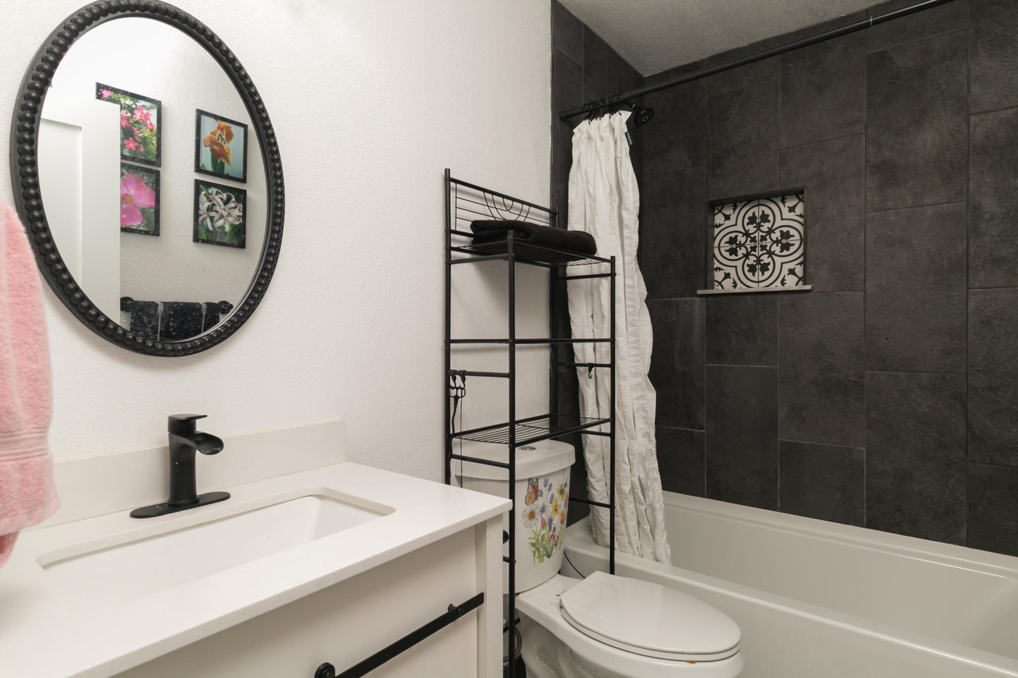 1141 Orange Loop Okeechobee, FL 34974 - Photo 16 of 20 a bathroom with a sink toilet and shower