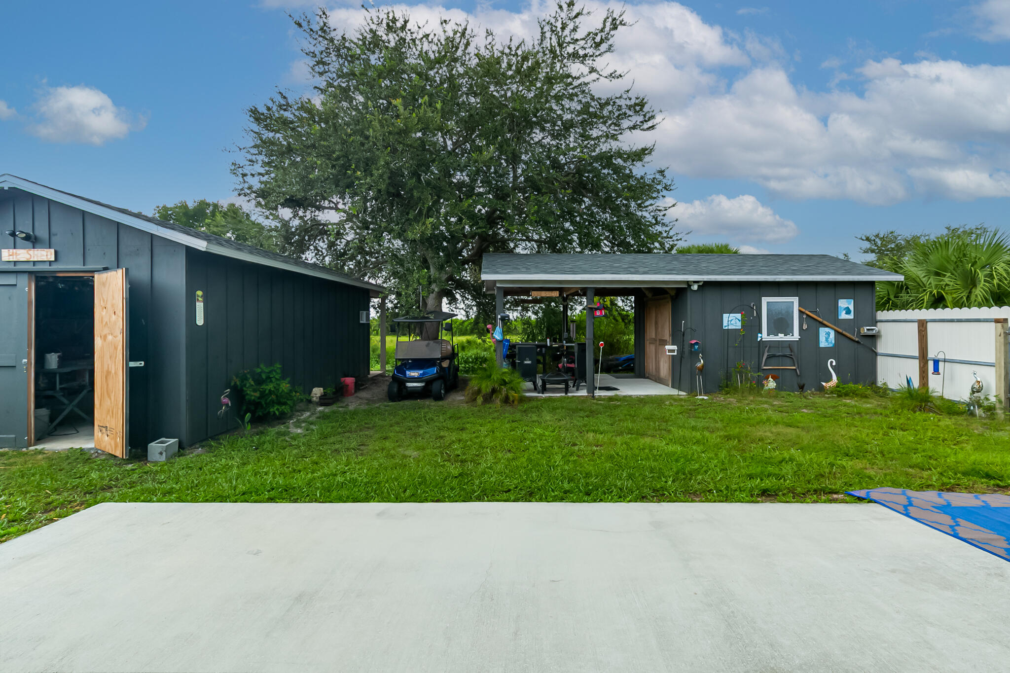 1141 Orange Loop Okeechobee, FL 34974 - Photo 19 of 20 a front view of a house with a yard