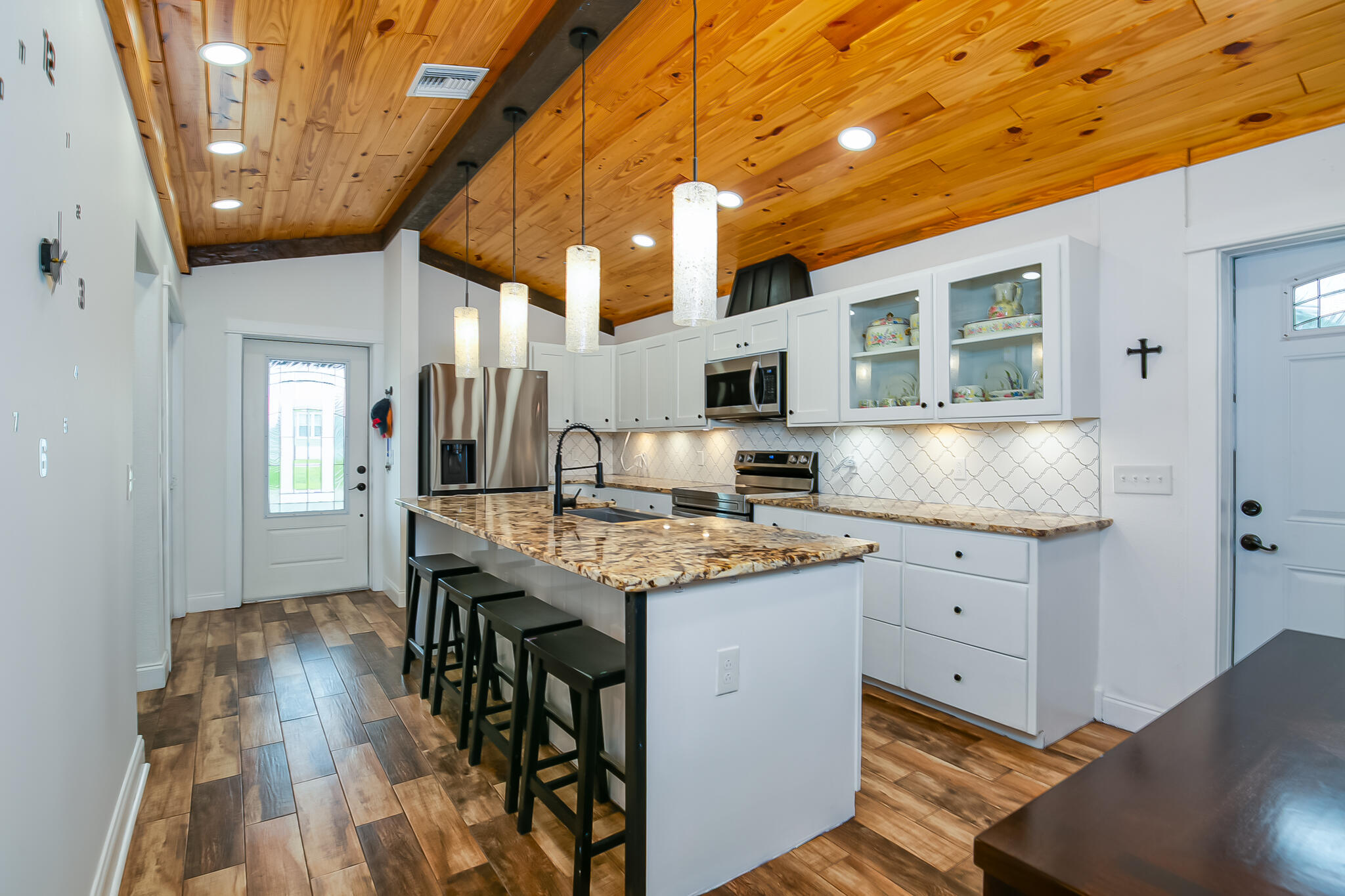 1141 Orange Loop Okeechobee, FL 34974 - Photo 7 of 20 a kitchen with granite countertop cabinets a sink and appliances