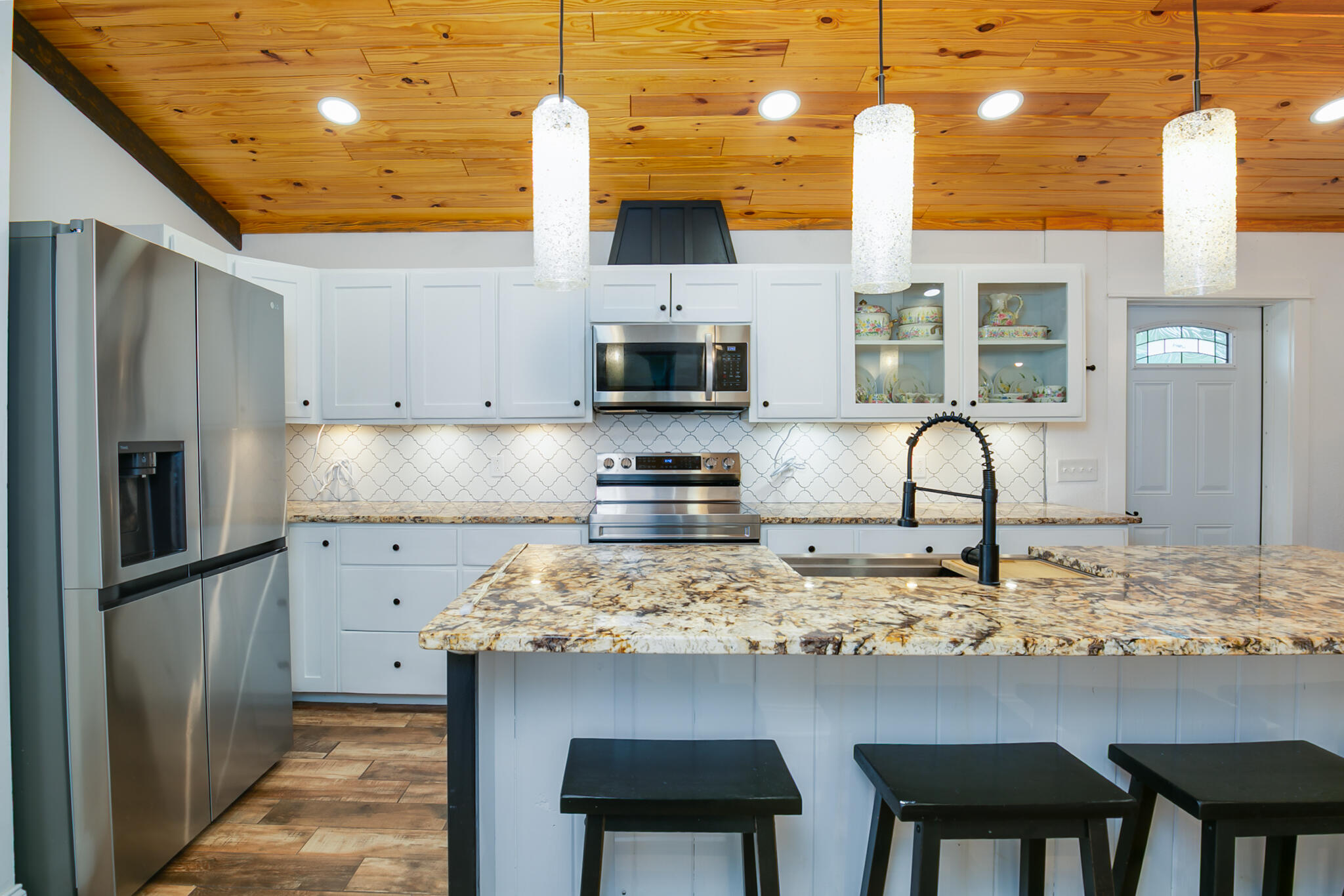 1141 Orange Loop Okeechobee, FL 34974 - Photo 8 of 20 a kitchen with stainless steel appliances granite countertop a sink and a refrigerator