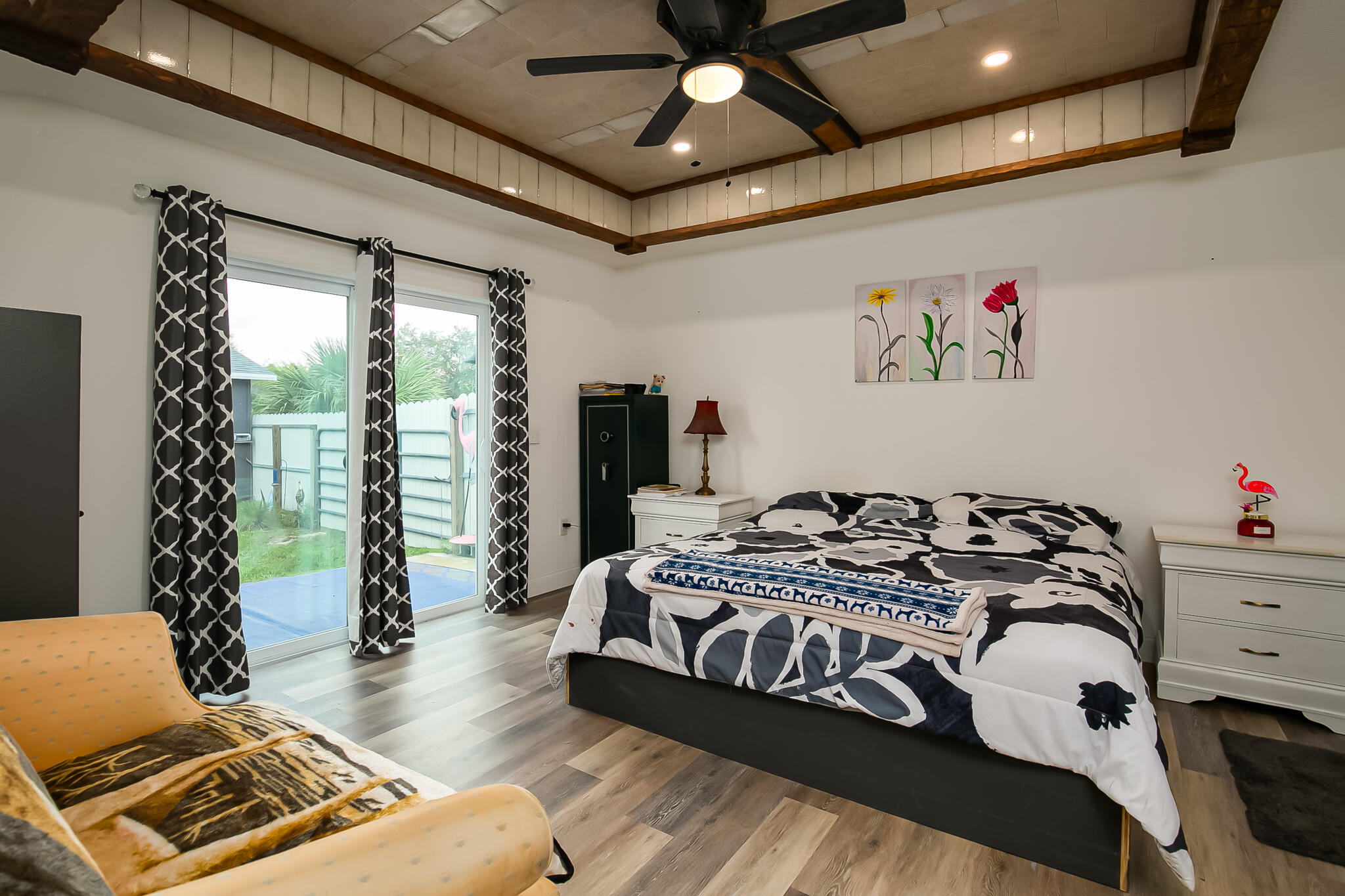 1141 Orange Loop Okeechobee, FL 34974 - Photo 9 of 20 a bedroom with a bed and a chandelier