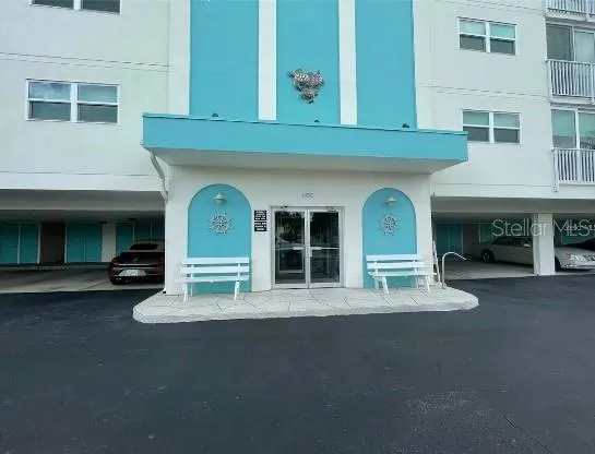 a front view of a building with a garage