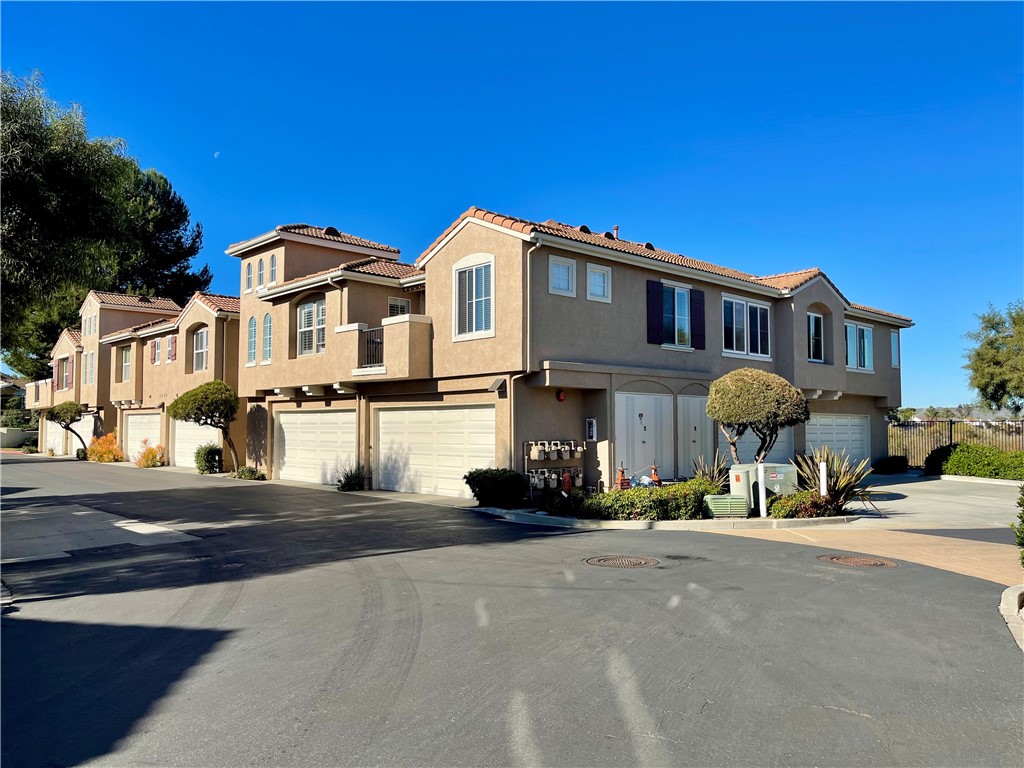 a view of a street with cars on road