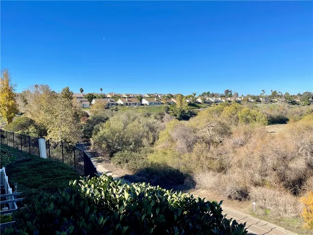 a view of empty room with ceiling fan
