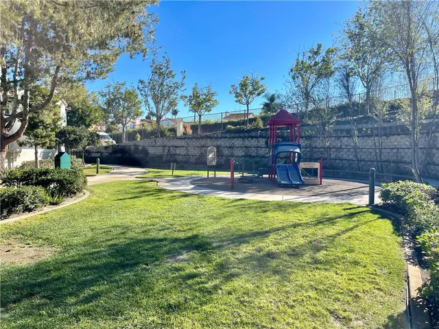 a view of a park with large trees