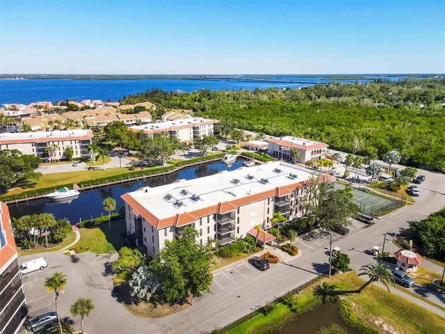 a kitchen with a sink a stove and a microwave