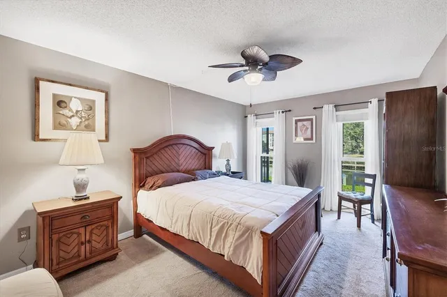 a view of walk in closet with clothes