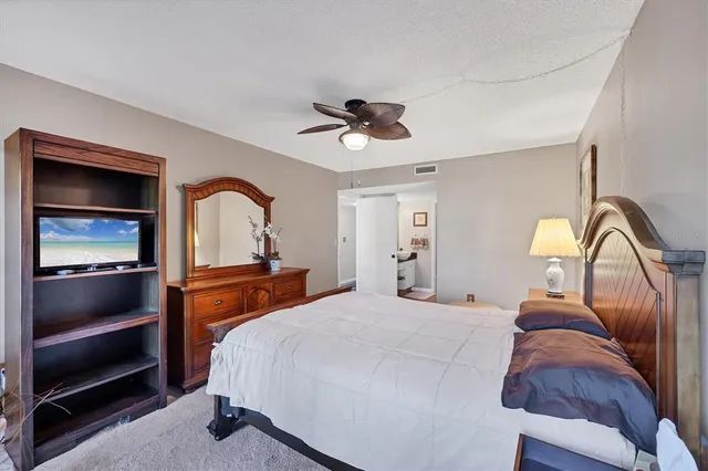 a bedroom with a bed and a dresser