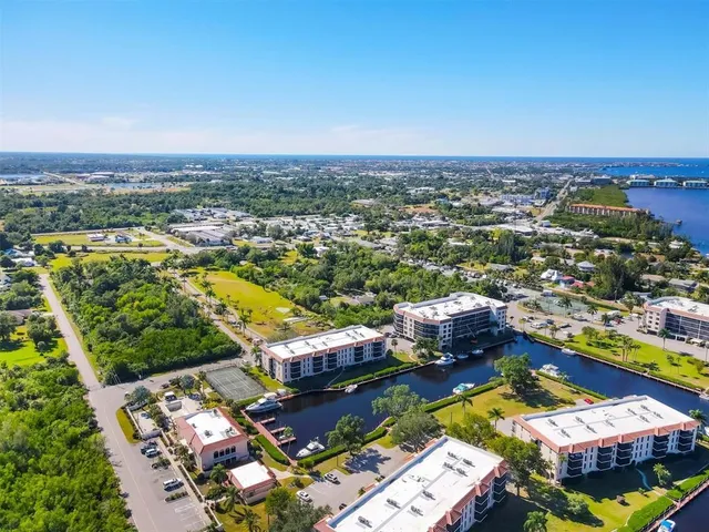 a view of a lake with a house in the background
