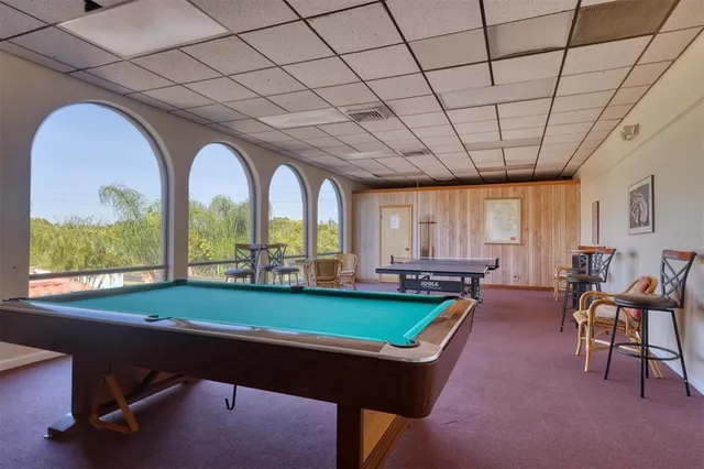 a view of a garden with cars parked
