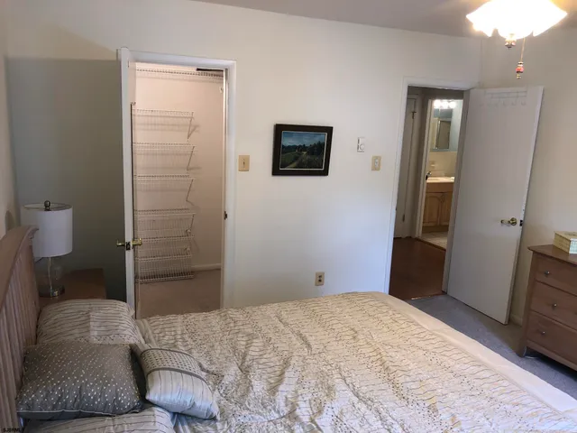 a bedroom with a bed and a television
