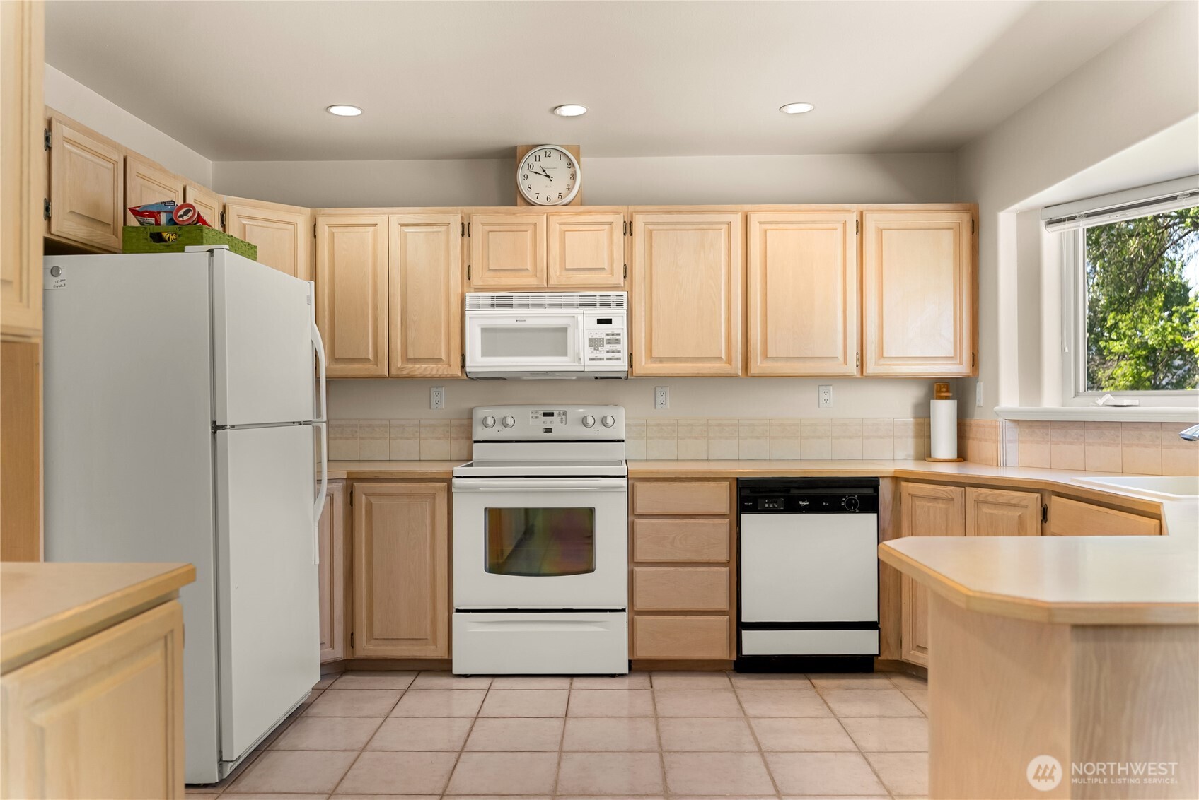 428 Eastlake Road Oroville, WA 98844 - Photo 12 of 34 a kitchen with a stove a refrigerator and a sink