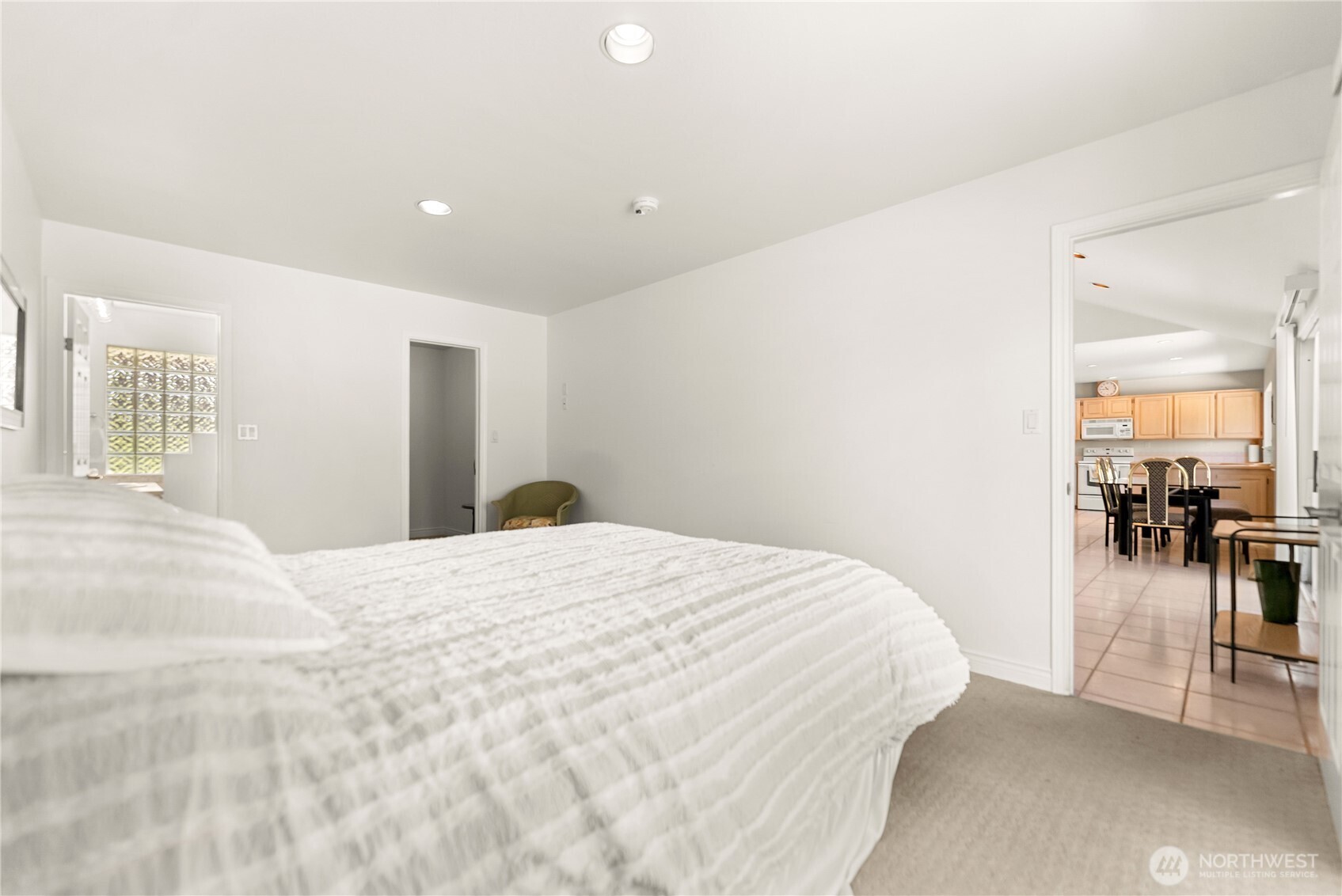 428 Eastlake Road Oroville, WA 98844 - Photo 15 of 34 a bedroom with a bed and glass door