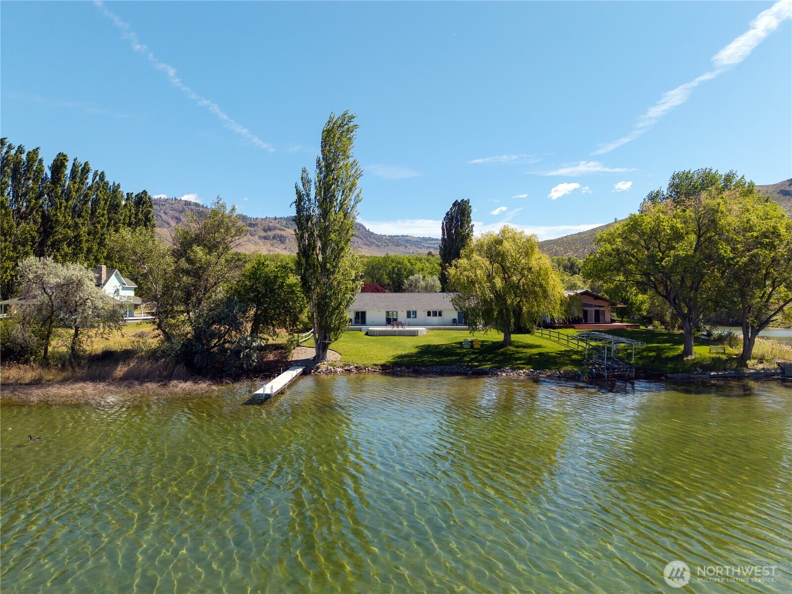 428 Eastlake Road Oroville, WA 98844 - Photo 2 of 34 a view of a lake with houses