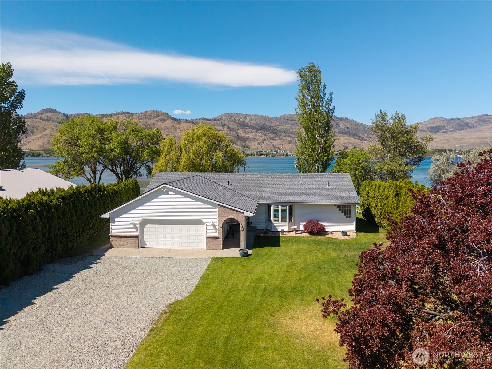 428 Eastlake Road Oroville, WA 98844 - Photo 3 of 34 a house view with a garden