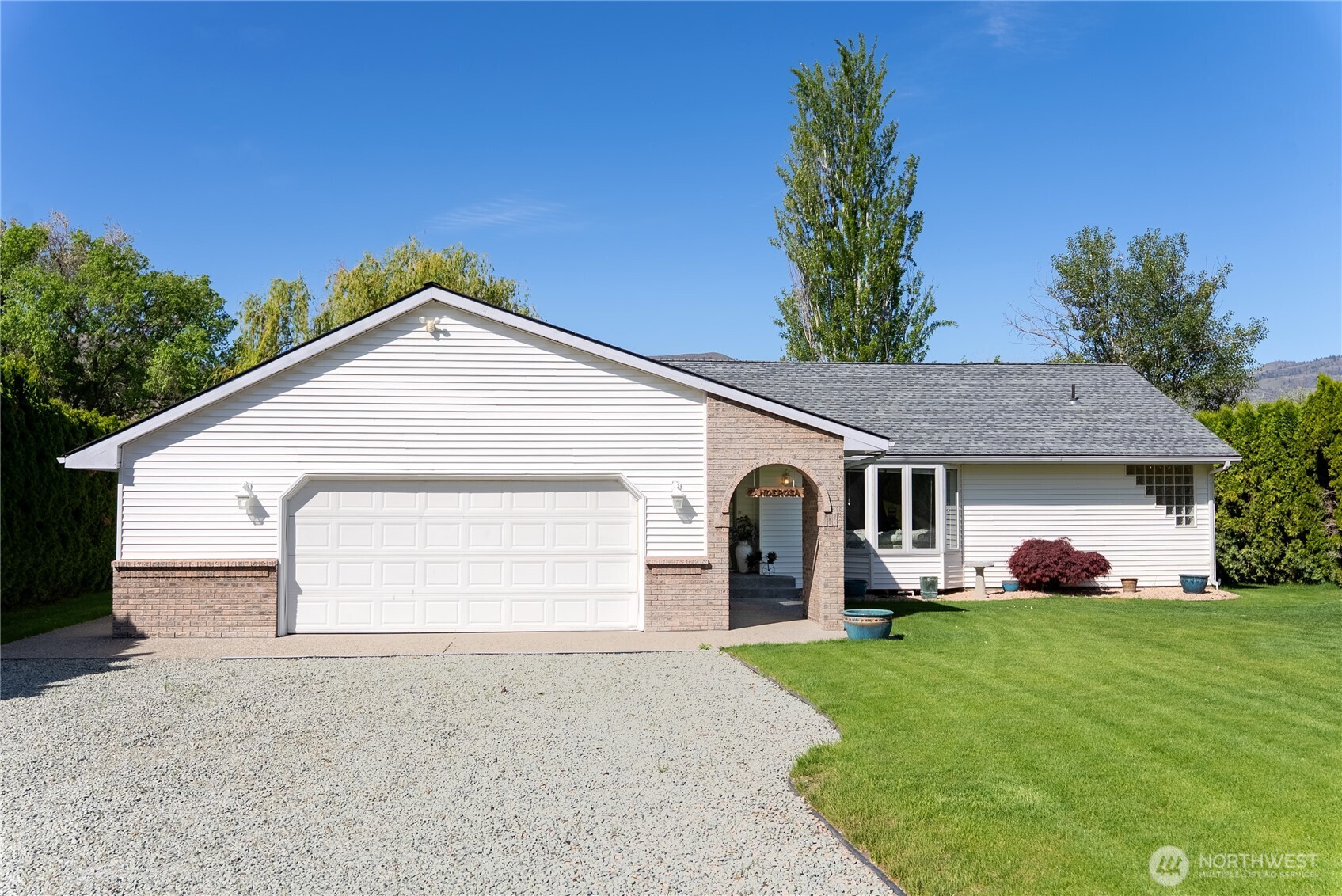428 Eastlake Road Oroville, WA 98844 - Photo 4 of 34 a view of a house with a yard