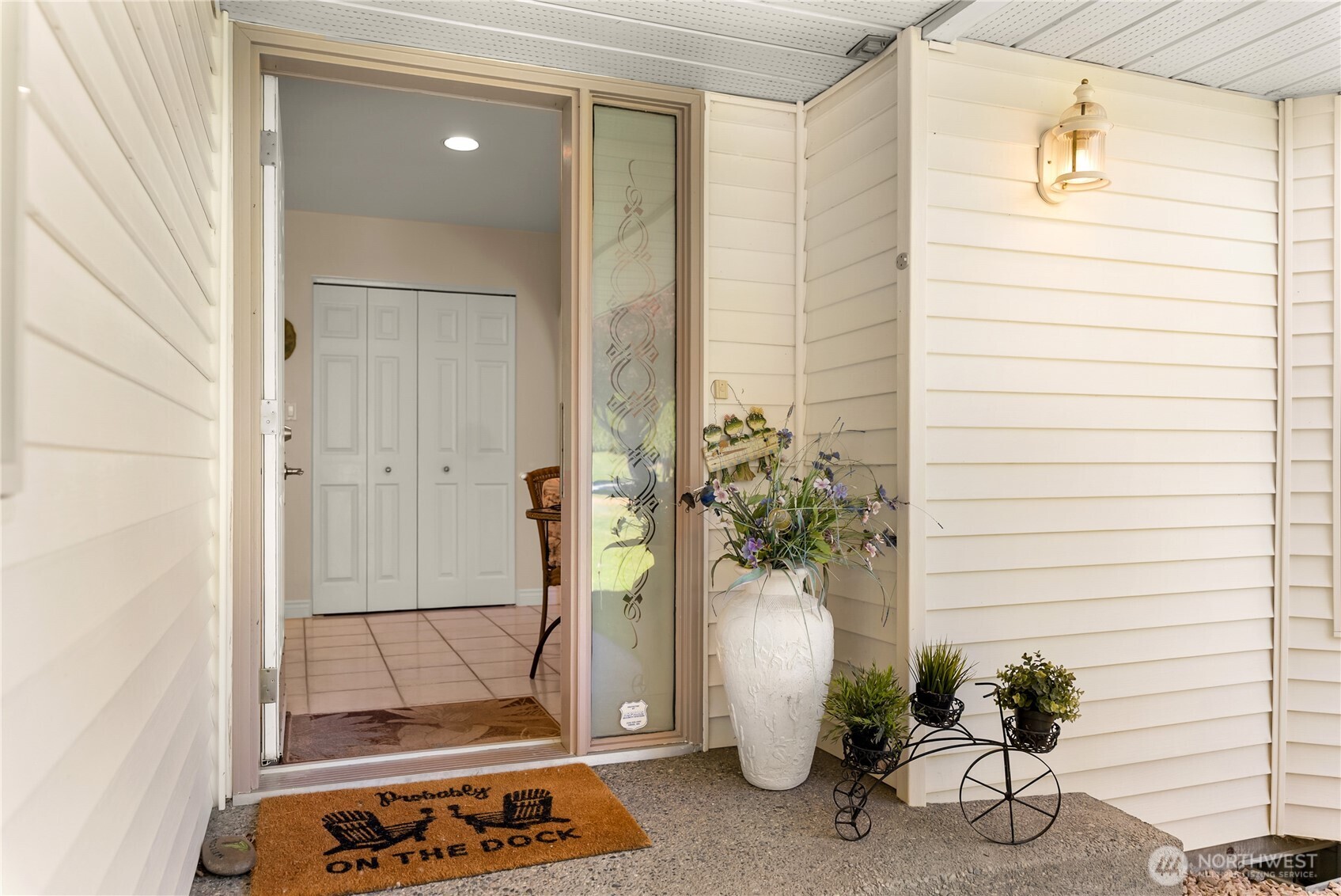428 Eastlake Road Oroville, WA 98844 - Photo 6 of 34 a potted plant sitting in front of a door