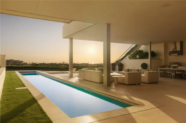 a view of balcony with couch and chairs