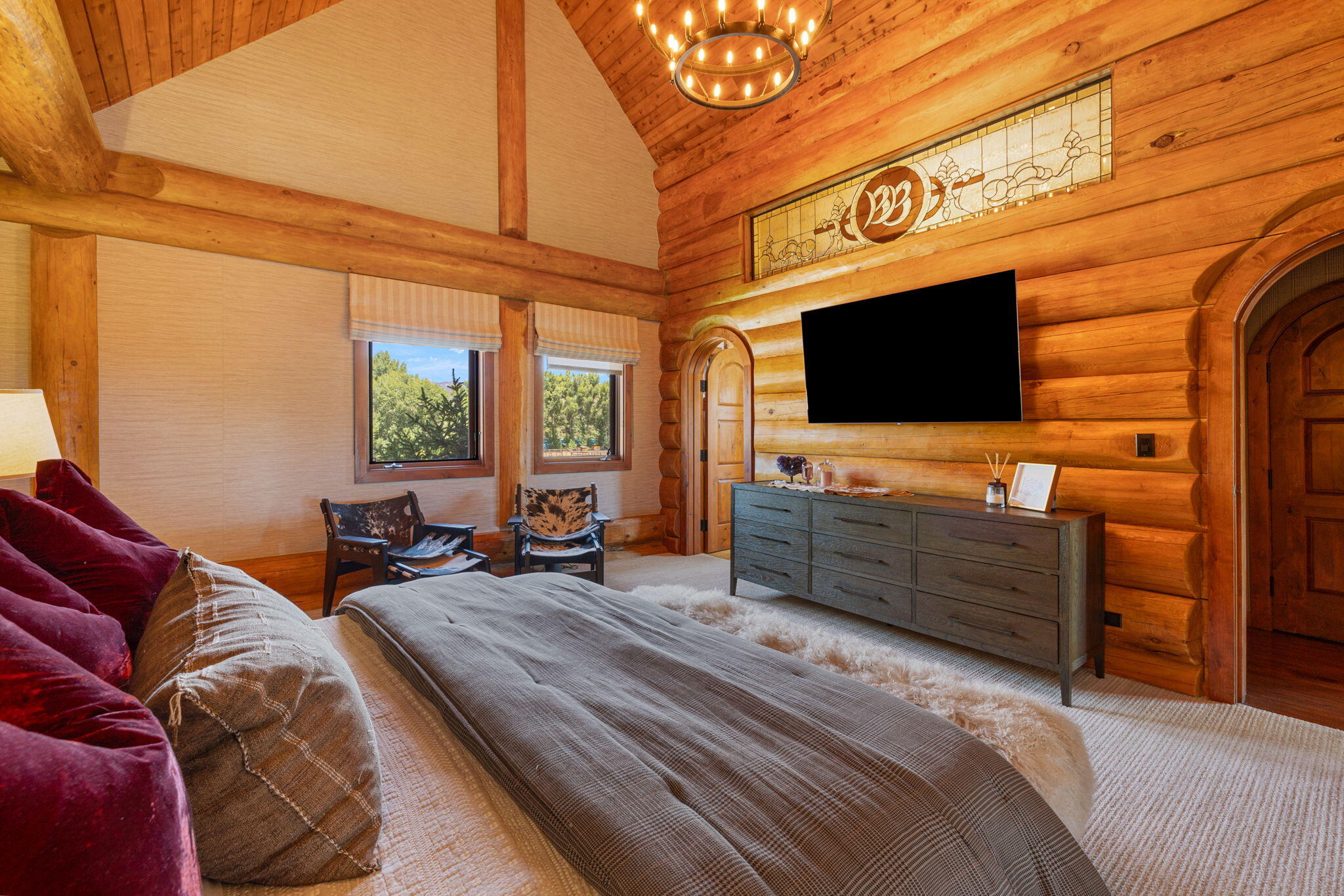 61380 Devils Ladder Road Mountain Center, CA 92561 - Photo 12 of 44 a bedroom with furniture and a flat screen tv