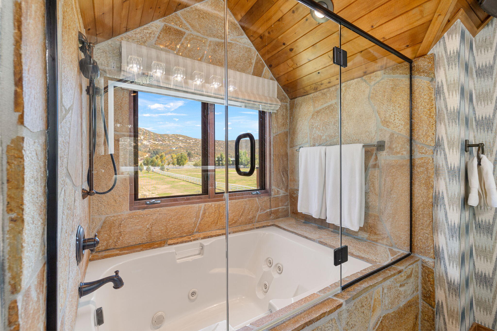 61380 Devils Ladder Road Mountain Center, CA 92561 - Photo 15 of 44 a bathroom with a bathtub and a shower