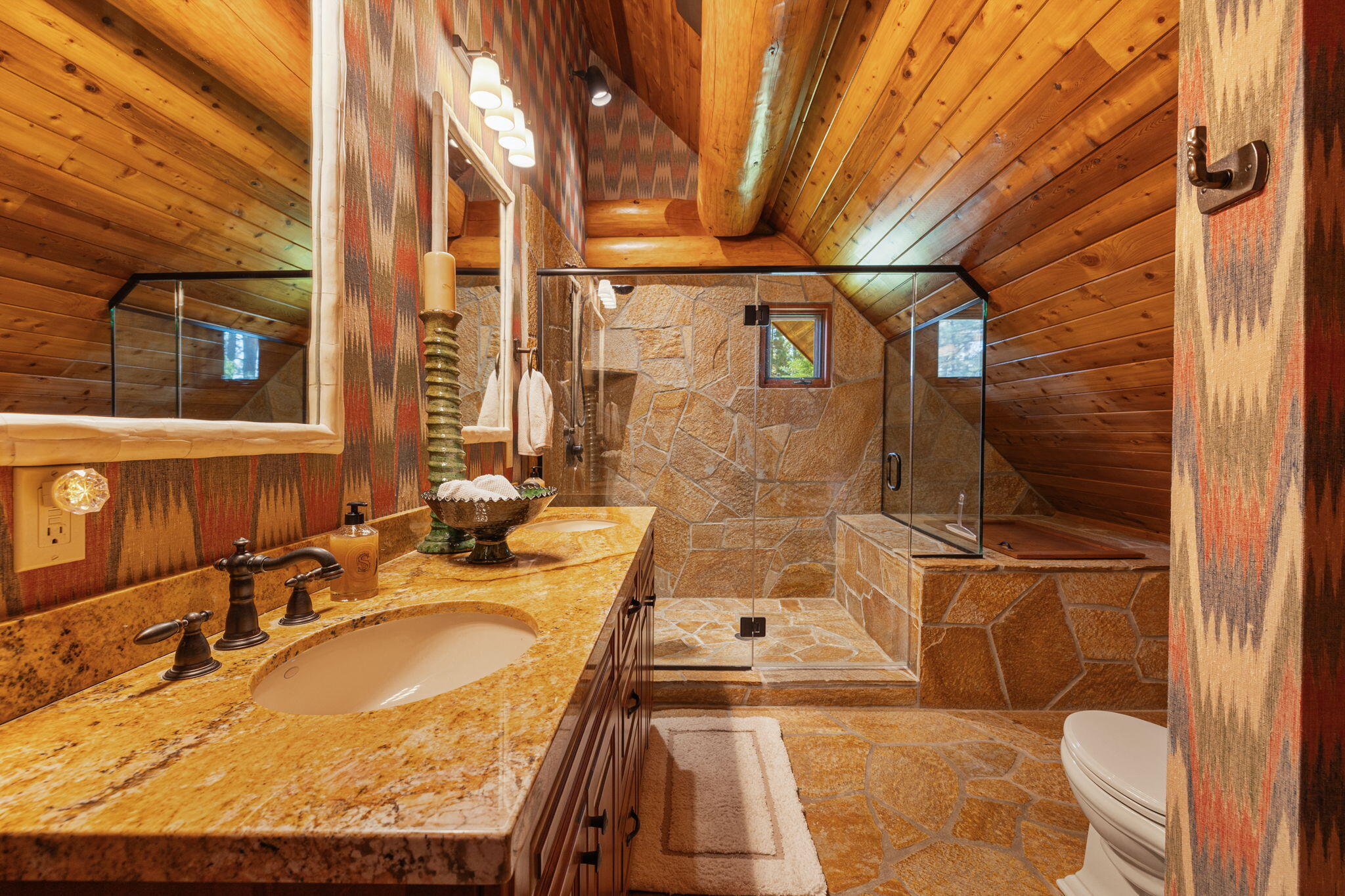 61380 Devils Ladder Road Mountain Center, CA 92561 - Photo 18 of 44 a bathroom with a granite countertop sink a toilet and shower