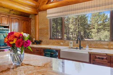 a kitchen with a sink and cabinets