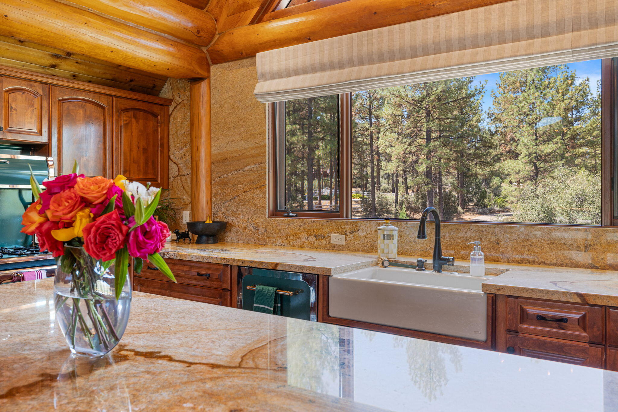 61380 Devils Ladder Road Mountain Center, CA 92561 - Photo 6 of 44 a kitchen with a sink and cabinets