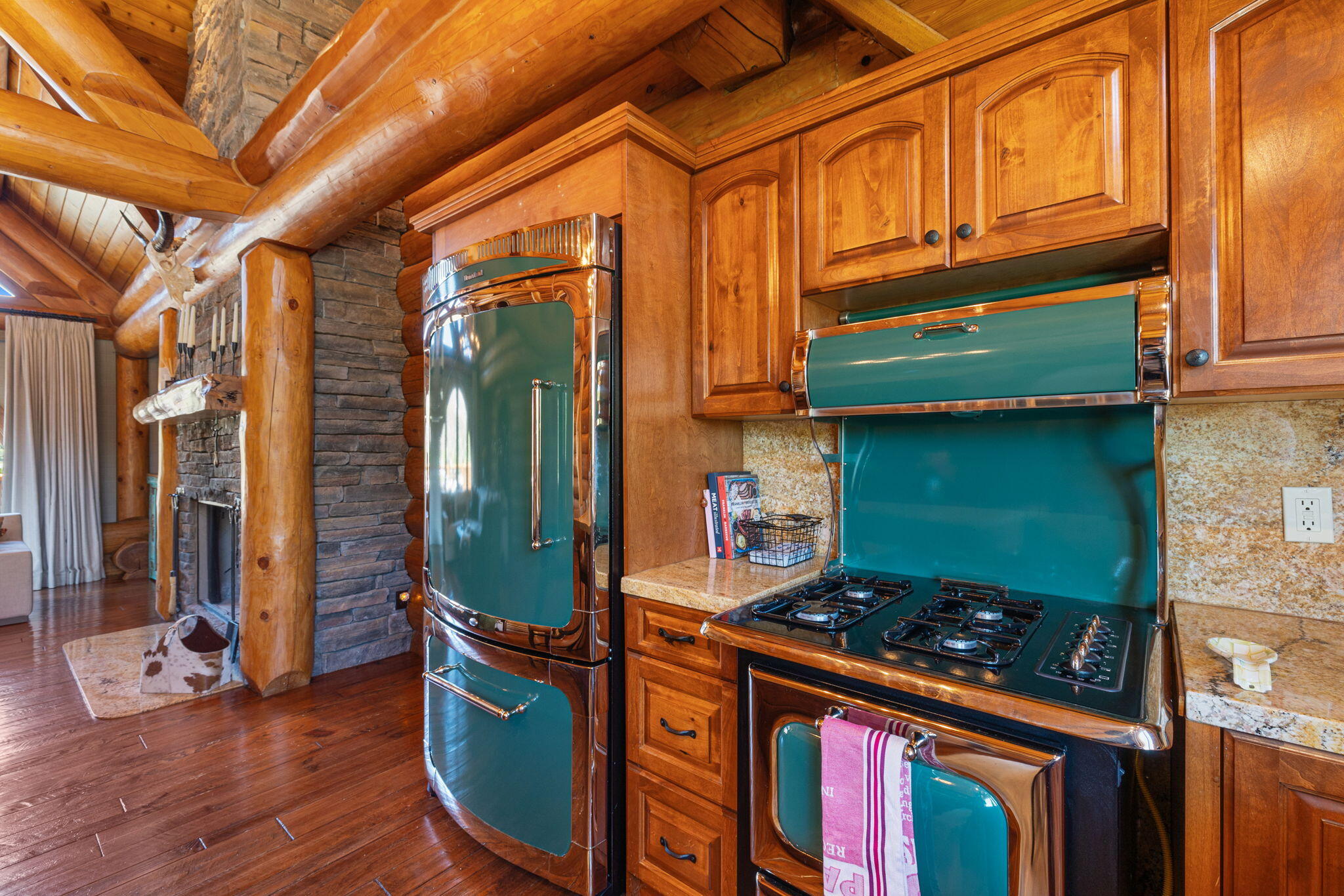 61380 Devils Ladder Road Mountain Center, CA 92561 - Photo 9 of 44 a kitchen with stainless steel appliances granite countertop a stove and a wooden cabinets