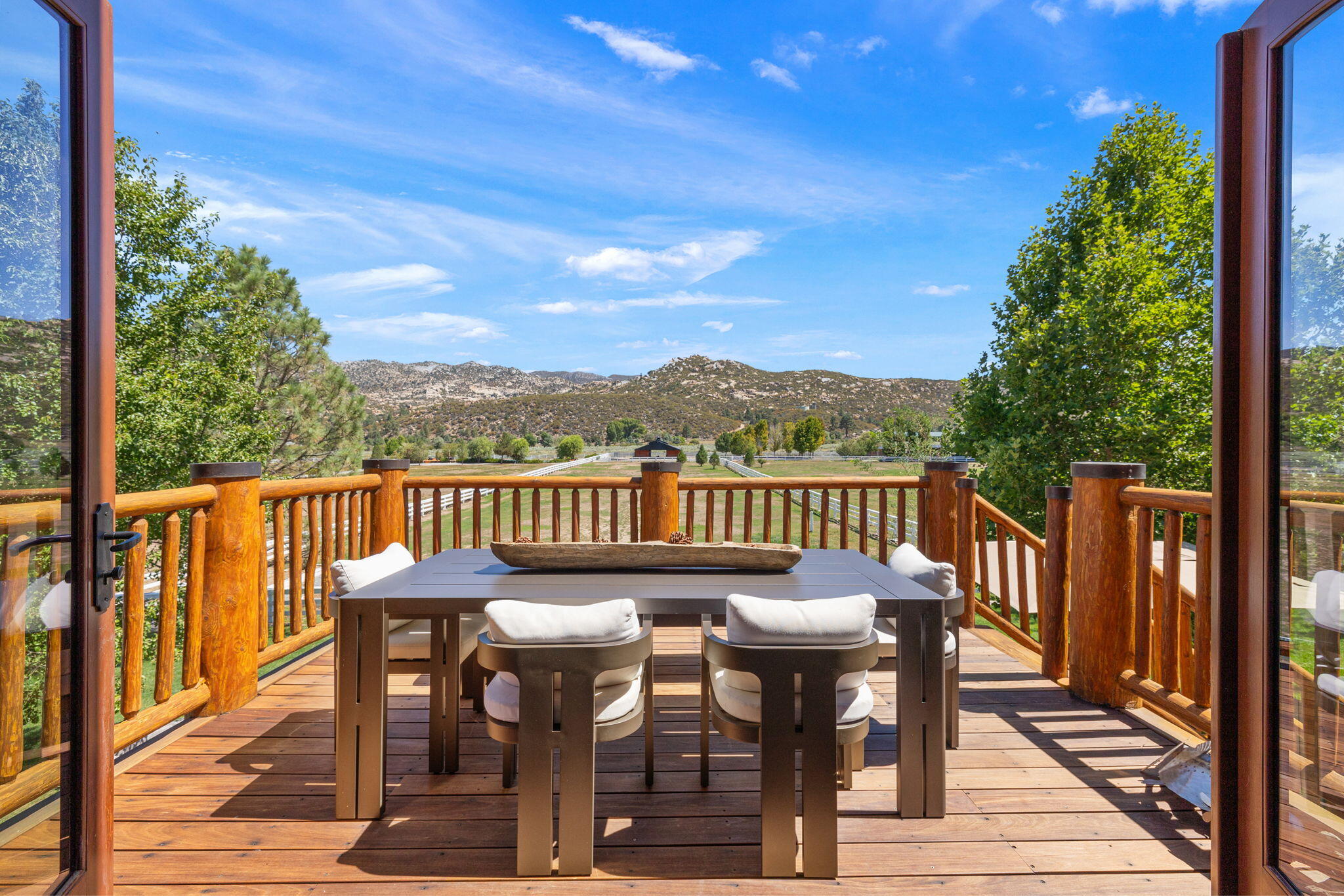 61380 Devils Ladder Road Mountain Center, CA 92561 - Photo 10 of 44 a view of a city from a balcony with furniture